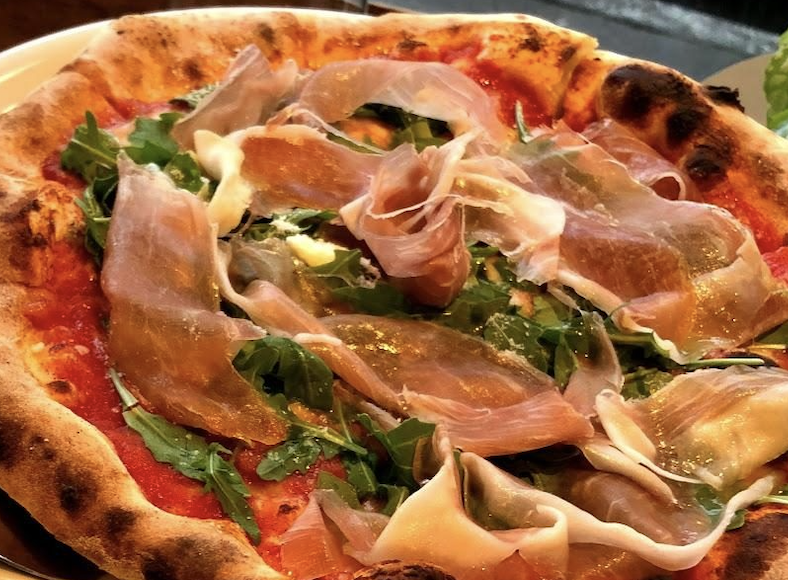Neapolitan Primavera pizza with rocket, prosciutto and buffalo mozzarella
